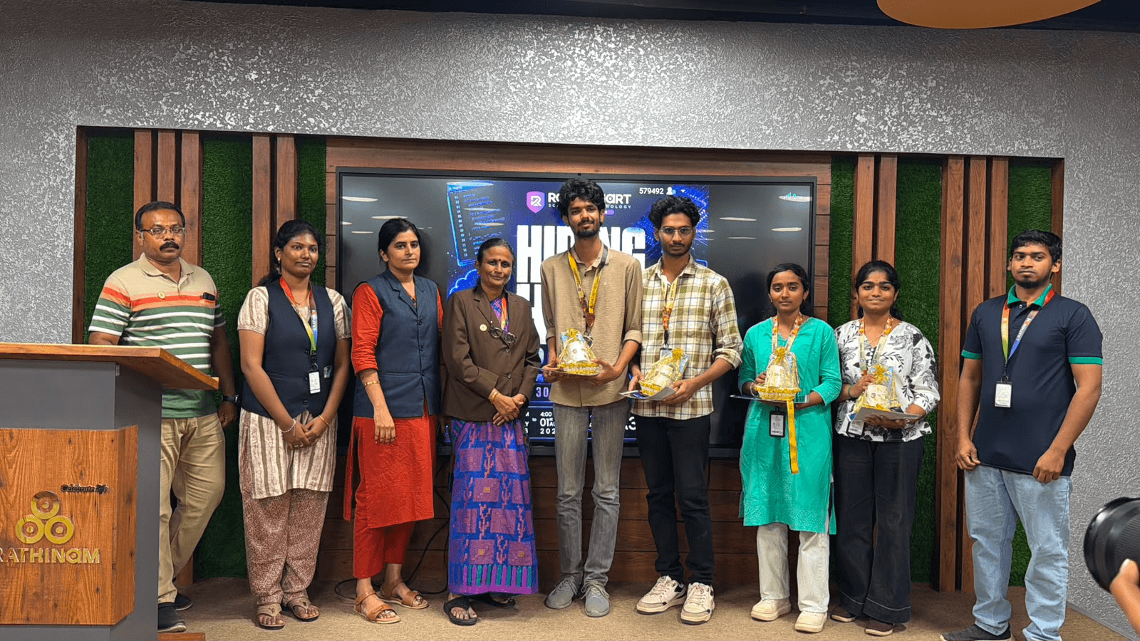 S4S hackathon winners with awards on stage